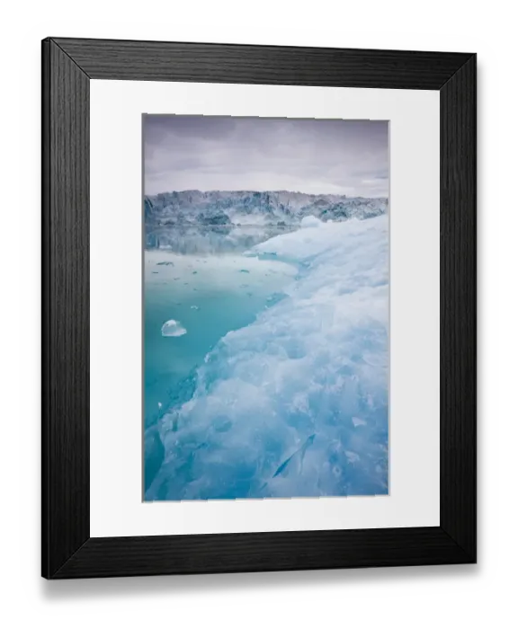 Framed Print : Norway, Svalbard, Spitsbergen, Blue iceberg floating near face of Lilliehook Glacier Framed Print : Norway, Svalbard, Spitsbergen, Blue iceberg floating near face of Lilliehook Glacier