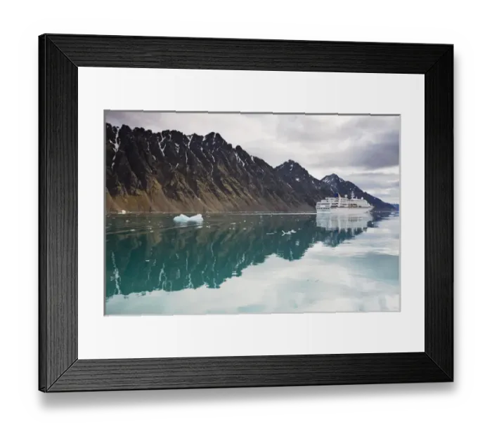 Framed Print : Norway, Svalbard, Spitsbergen, Cruise Ship MV Columbus motoring past mountains along