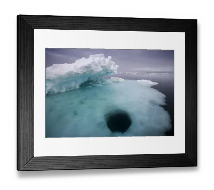 Framed Print : Norway, Svalbard, Storfjorden Fjord, Hole melting in iceberg floating on summer evening