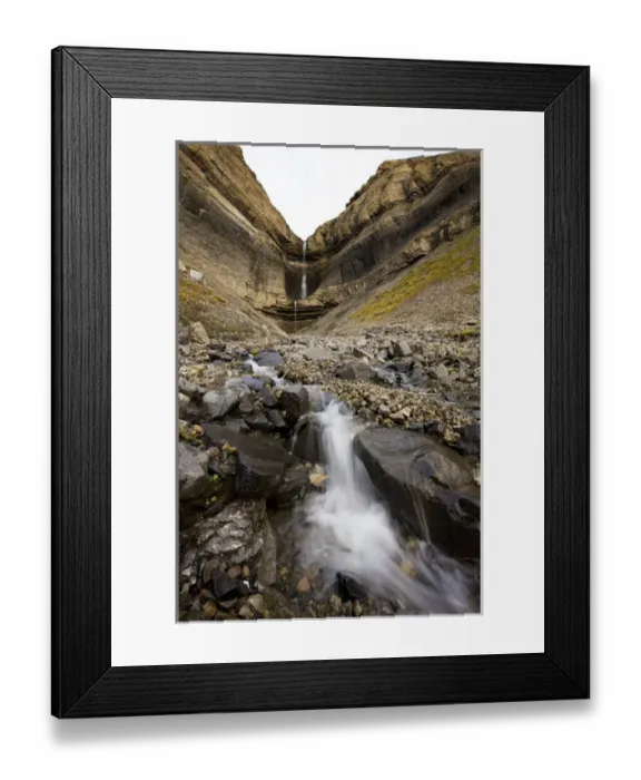Framed Print : Norway, Svalbard, Spitsbergen, Waterfall and mountain peaks along Isfjorden