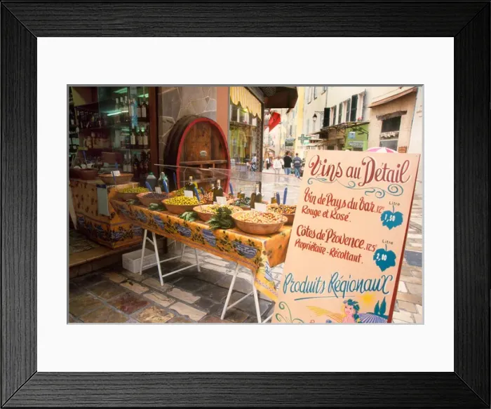 Framed Print : France, Riviera, Hyeres - Olive and wine display with sign advertising local wine