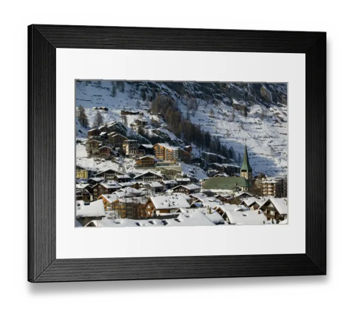 Framed Print : SWITZERLAND-Wallis / Valais-ZERMATT: Town View & Parish Church from the West / Winter Framed Print : SWITZERLAND-Wallis / Valais-ZERMATT: Town View & Parish Church from the West / Winter