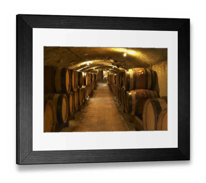 Framed Print : Wooden barrels with aging wine in the cellar of Guigal in Ampuis. Domaine E Guigal Framed Print : Wooden barrels with aging wine in the cellar of Guigal in Ampuis. Domaine E Guigal