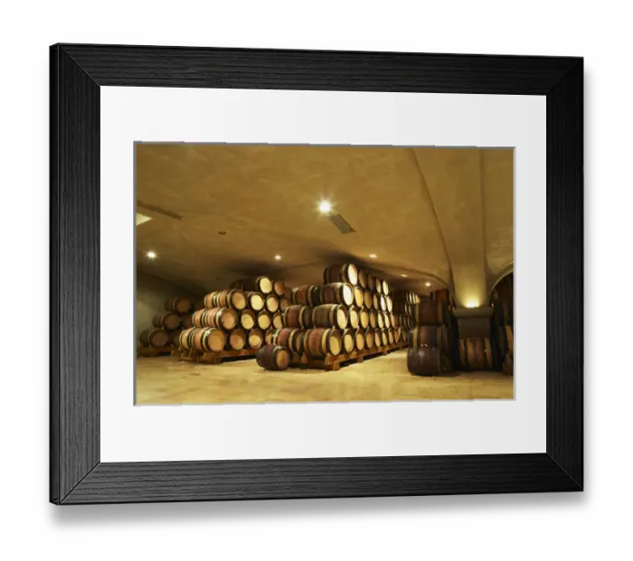 Framed Print : Wooden barrels with aging wine in the cellar of Guigal in Ampuis. The vaulted roof