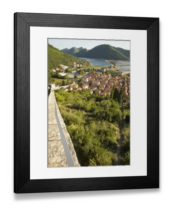 Framed Print : Europe, Croatia, Dalmatia, Mali Ston. Salt pans, lush hills and village of Mali Ston