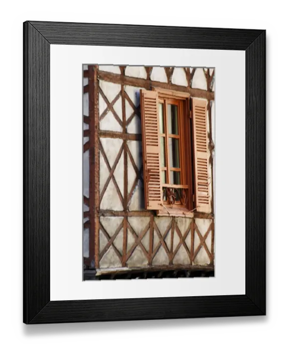 Framed Print : A building in the town with old half timber facade and wooden shutters. Vienne, Isere Isere Framed Print : A building in the town with old half timber facade and wooden shutters. Vienne, Isere Isere