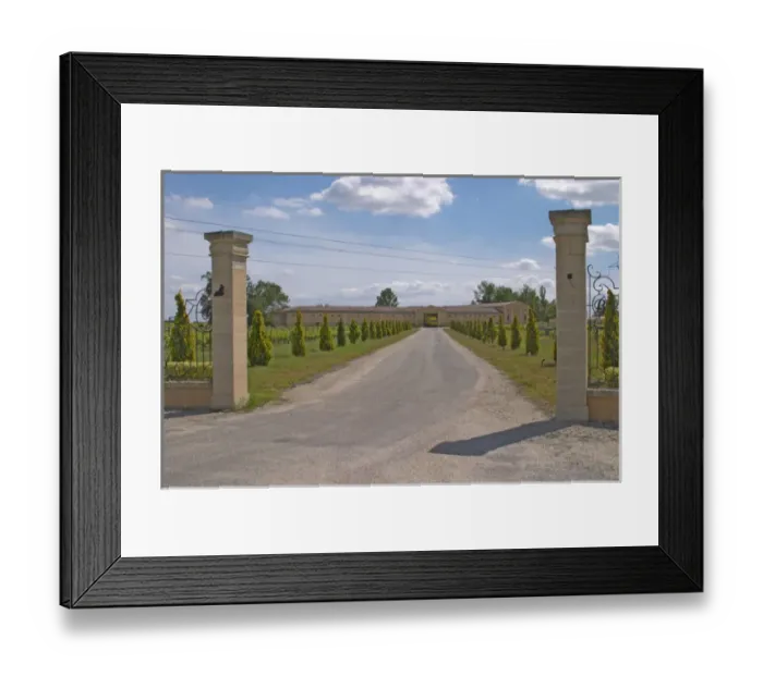 Framed Print : The back entrance to the Chateau Haut Bertinerie with gate posts and a tree lined
