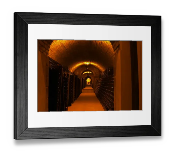 Framed Print : The underground wine cellar, thousands of bottles aging either in pupitres (racks)