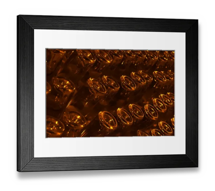 Framed Print : The underground wine cellar, bottles aging in pupitres (racks) upside down waiting to be disgorged
