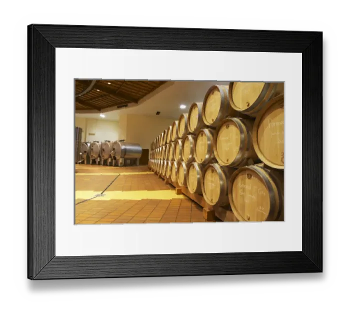 Framed Print : Oak barrels in rows and stainless steel roto-fermenters rotofermenters, Maison Louis Jadot