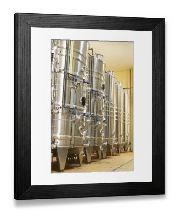 Framed Print : Stacks of stainless steel fermentation vats in various sizes and with cooling systems Framed Print : Stacks of stainless steel fermentation vats in various sizes and with cooling systems