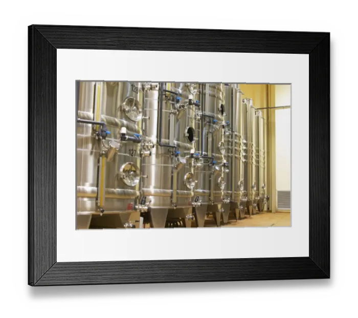 Framed Print : Stacks of stainless steel fermentation vats in various sizes and with cooling systems Framed Print : Stacks of stainless steel fermentation vats in various sizes and with cooling systems