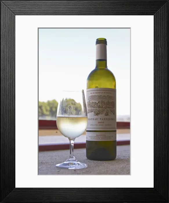 Framed Print : Glass of white wine with the text Chateau Vannieres and a bottle of white wine Chateau Vannieres