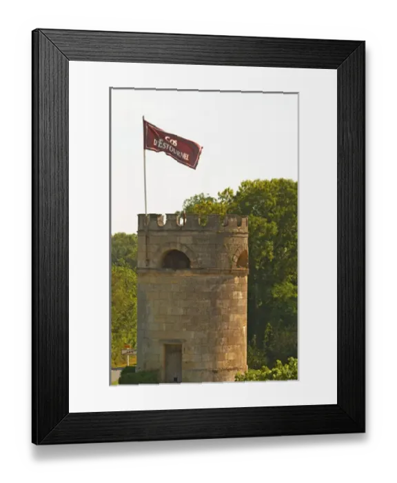 Framed Print : A tower in the vineyard at Chateau Cos d Estournel with a flag with the name Framed Print : A tower in the vineyard at Chateau Cos d Estournel with a flag with the name