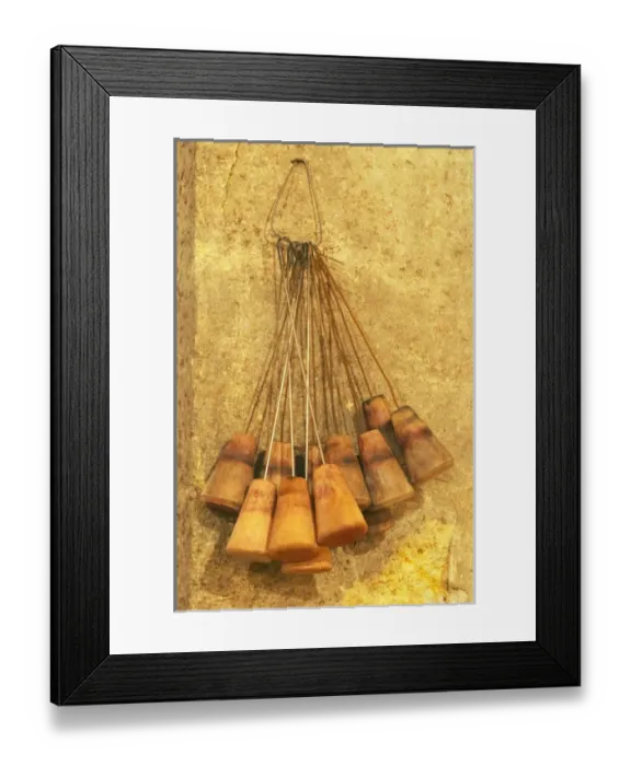 Framed Print : wooden bung plugs with an iron wire hook that are used for cleaning the barrles with Framed Print : wooden bung plugs with an iron wire hook that are used for cleaning the barrles with