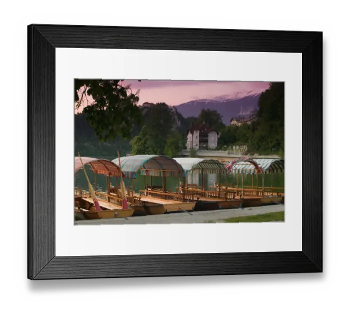 Framed Print : SLOVENIA-GORENJSKA-Bled: Lake Bled Gondolas (pletni) from Mlino Village  /  Dusk