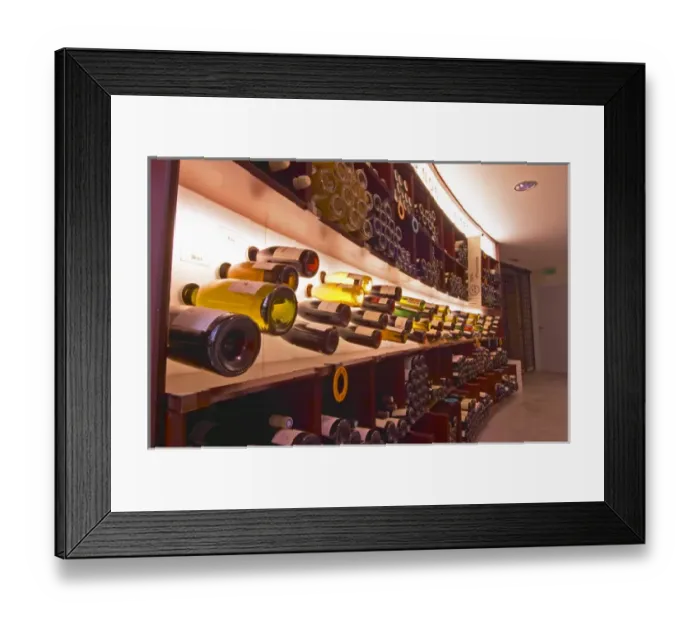Framed Print : A curved display of bottles. Backlit The Lavinia wine shop in Paris. Probably Framed Print : A curved display of bottles. Backlit The Lavinia wine shop in Paris. Probably