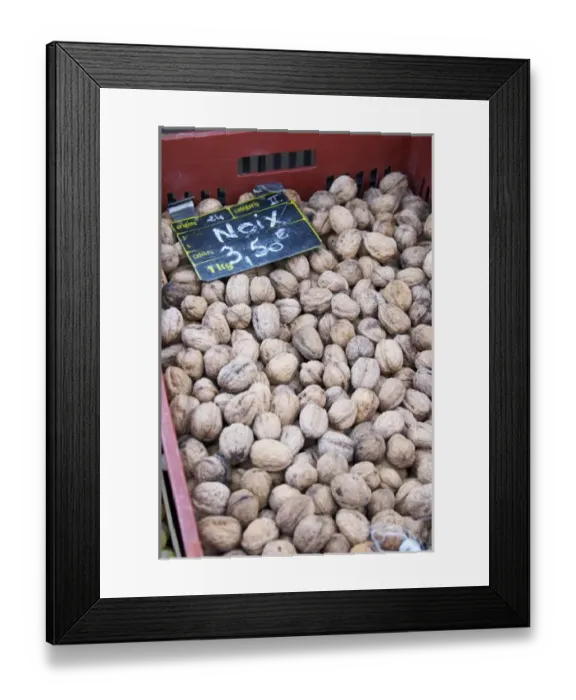 Framed Print : Walnuts for sale at a market stall at the market in Bergerac for 3. 50 euro per kilo Framed Print : Walnuts for sale at a market stall at the market in Bergerac for 3. 50 euro per kilo