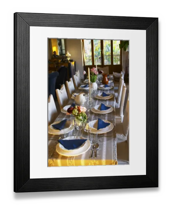 Framed Print : The dining room table decorated and set with flowers and decorative vegetables for dinner guests Framed Print : The dining room table decorated and set with flowers and decorative vegetables for dinner guests