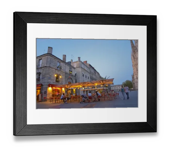 Framed Print : A cafe on the place pey berland in Bordeaux, outside seating terrasse lit by electric lights
