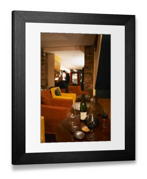 Framed Print : Bottle on a table with wine glasses and decanter in the wine bar Le Cafe du Passage in Paris Framed Print : Bottle on a table with wine glasses and decanter in the wine bar Le Cafe du Passage in Paris