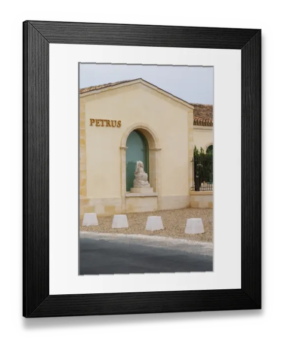 Framed Print : Renovated Chateau Petrus with a sign with the name in gold and a stone statue of Framed Print : Renovated Chateau Petrus with a sign with the name in gold and a stone statue of