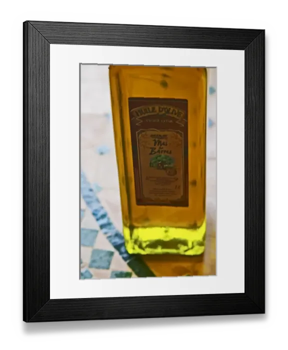 Framed Print : In the shop, a bottle of olive oil, back lit. Moulin Mas des Barres olive mill