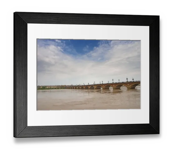 Framed Print : The famous old Pont de Pierre bridge across the Garonne river and the city Framed Print : The famous old Pont de Pierre bridge across the Garonne river and the city