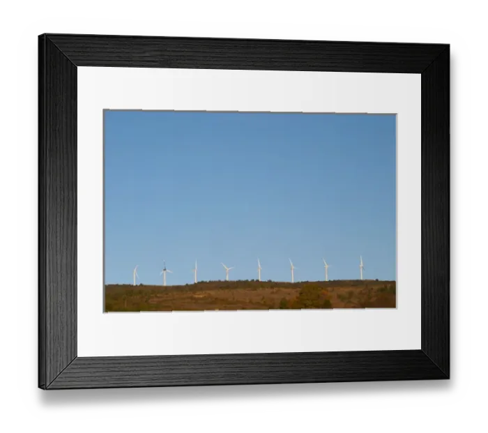 Framed Print : Wind power turbines on a mountain hill top crest against a blue sky. Limoux. Languedoc Framed Print : Wind power turbines on a mountain hill top crest against a blue sky. Limoux. Languedoc
