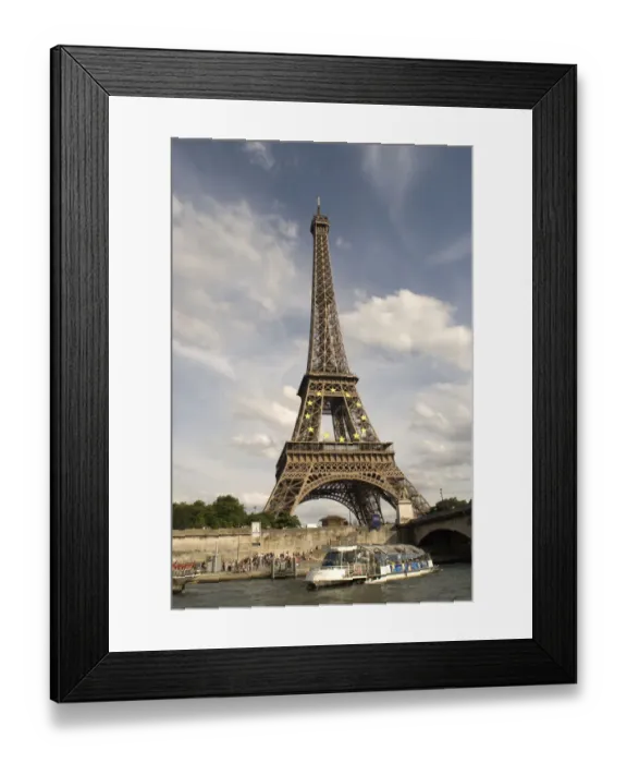 Framed Print : The Eiffel Tower and a tourist boat on the River Seine viewed from near the Jardin du Trocadero