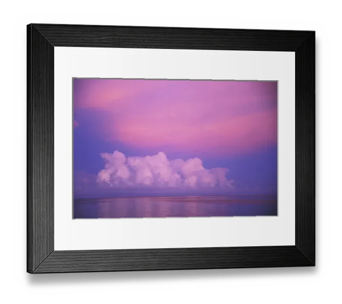 Framed Print : Clouds and sunset over water
