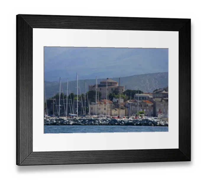 Framed Print : Corsica. France. Europe. Mast of boats & breakwater below citadel & other buildings of St Framed Print : Corsica. France. Europe. Mast of boats & breakwater below citadel & other buildings of St