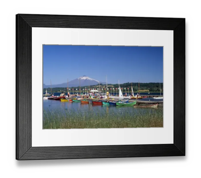 Framed Print : Boats docked at a marina with Villarica volcano in Villarica, Chile