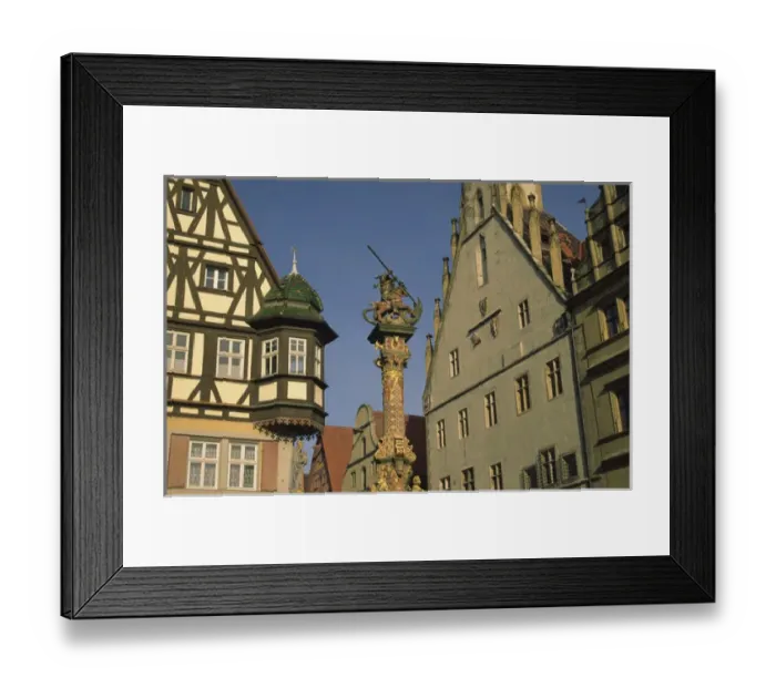 Framed Print : Germany, Rothenburg, Looking up at buildings and statue of St. George and the Dragon