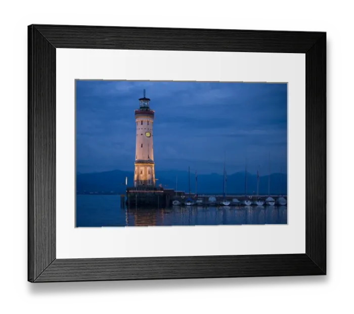 Framed Print : Europe, Germany, Lake Constance. View of lighthouse on Lindau Island at sunset. Credit as Framed Print : Europe, Germany, Lake Constance. View of lighthouse on Lindau Island at sunset. Credit as
