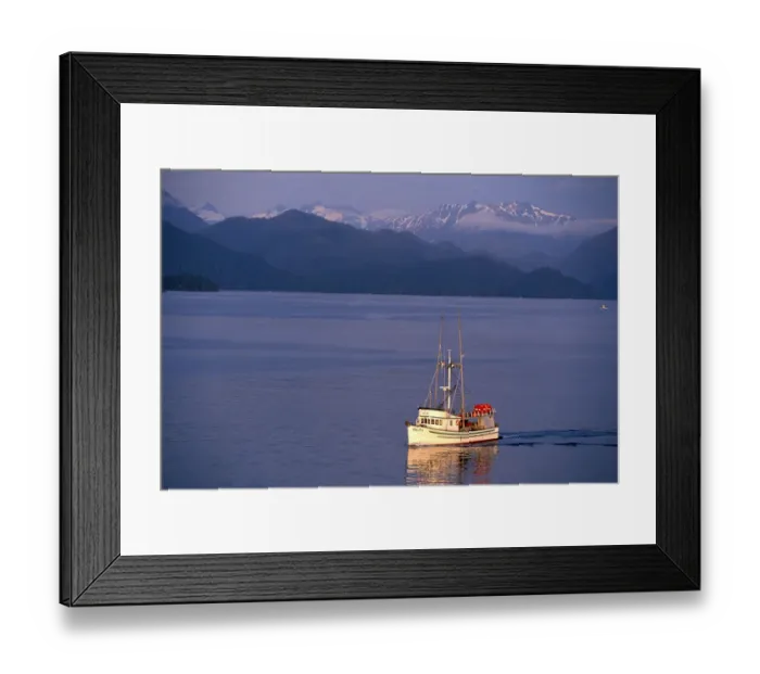 Framed Print : NA, USA, Alaska, Sitka, A fishing boat returns to Sitka; Baranof Island behind Framed Print : NA, USA, Alaska, Sitka, A fishing boat returns to Sitka; Baranof Island behind