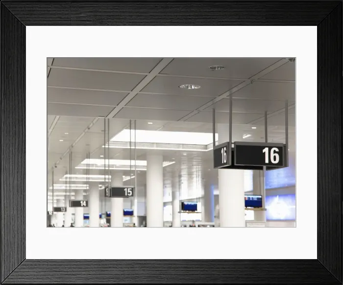 Framed Print : Frankfurt, Brandenburg, Germany - Gate numbers are hanging from the ceiling in an airport