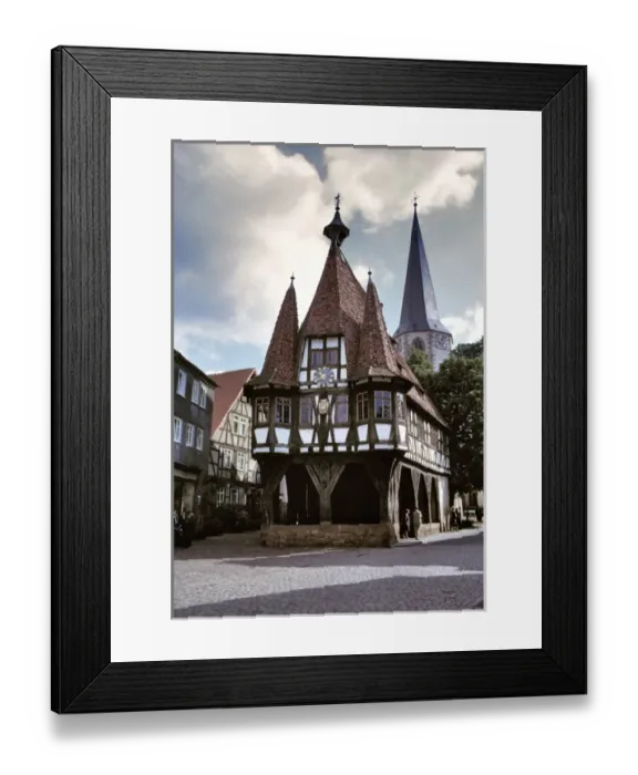Framed Print : The Old Town Hall and Pfarrkirche Steeple are landmarks in Michelstadt in Hessen, Germany Framed Print : The Old Town Hall and Pfarrkirche Steeple are landmarks in Michelstadt in Hessen, Germany