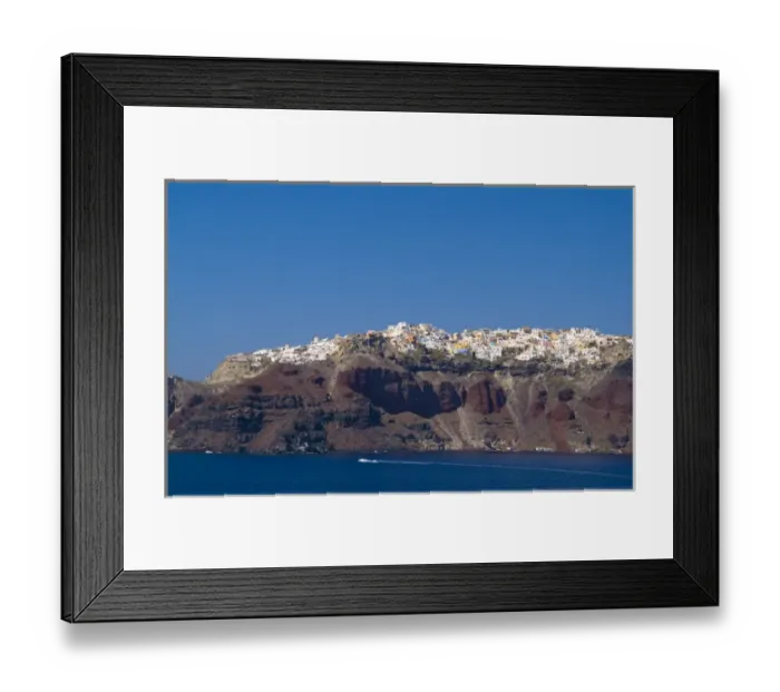 Framed Print : Santorini Greece and the beautiful white buildings on the mountain cliffs from a ship