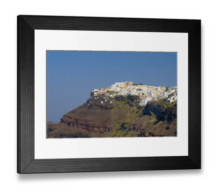 Framed Print : Santorini Greece and the beautiful white buildings on the mountain cliffs of main
