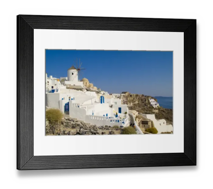Framed Print : Santorini Greece and the beautiful white buildings on the mountain cliffs of Framed Print : Santorini Greece and the beautiful white buildings on the mountain cliffs of
