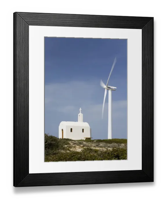 Framed Print : Crete. Greece. Europe. Wind turbine of Plastika Kritis wind farm towers above Church Agios Ioannis Framed Print : Crete. Greece. Europe. Wind turbine of Plastika Kritis wind farm towers above Church Agios Ioannis