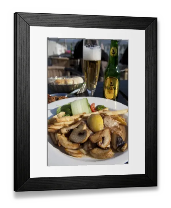 Framed Print : ICELAND20739_JUL2009_BARTRUFF. CR2-Fish and chips Icelandic style is served at a rooftop