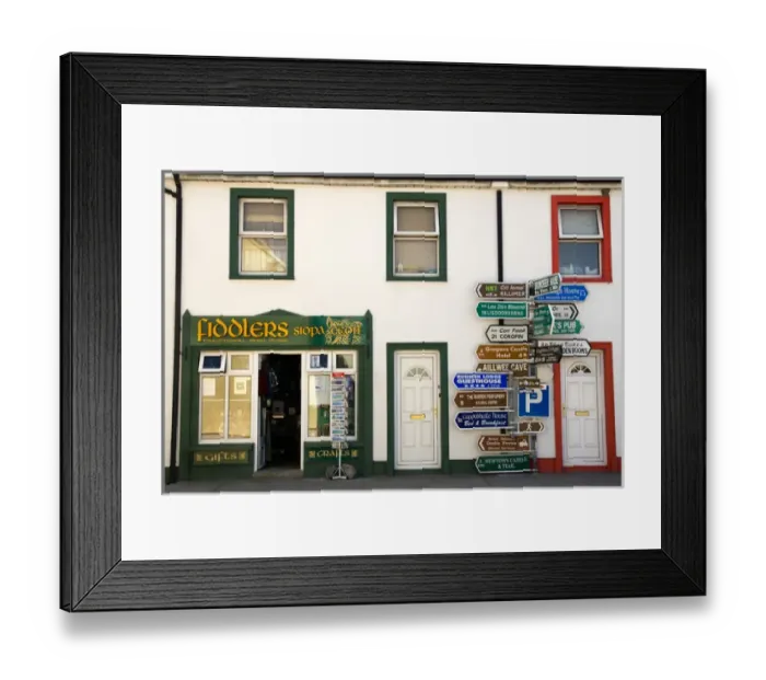 Framed Print : Europe, Ireland, Ballyvaughan. Store fronts and an informative sign post in the village center Framed Print : Europe, Ireland, Ballyvaughan. Store fronts and an informative sign post in the village center