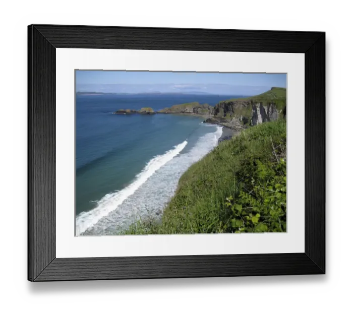 Framed Print : Northern Ireland, scenic coastal view along pathway out to historic Carrick-a-rede rope bridge