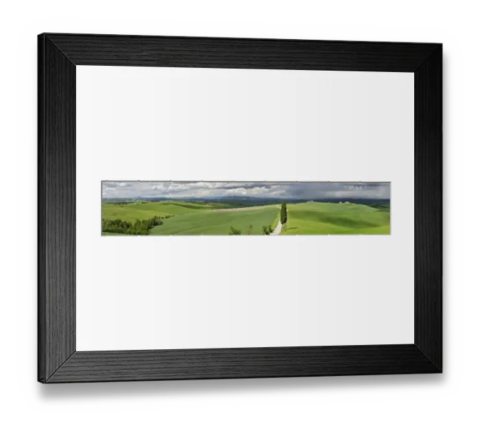 Framed Print : Road winding through agricultural region of Tuscany with storm clouds, Italy