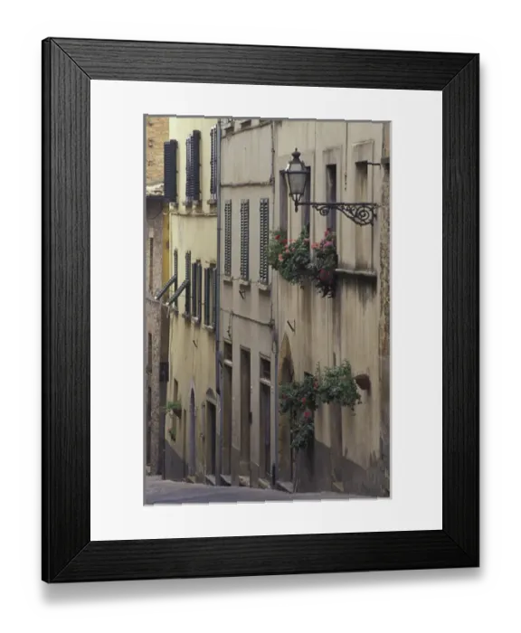 Framed Print : Italy, Tuscany, Volterra Geraniums and old houses on narrow street Framed Print : Italy, Tuscany, Volterra Geraniums and old houses on narrow street