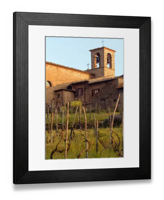 Framed Print : Above rows of grapevines, a church bell tower stands, in the Lamole area of Tuscany Framed Print : Above rows of grapevines, a church bell tower stands, in the Lamole area of Tuscany
