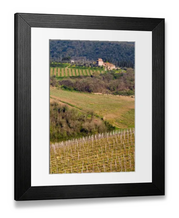 Framed Print : A grand stone winery stands above rolling vineyards in the Chianti area of Tuscany Framed Print : A grand stone winery stands above rolling vineyards in the Chianti area of Tuscany