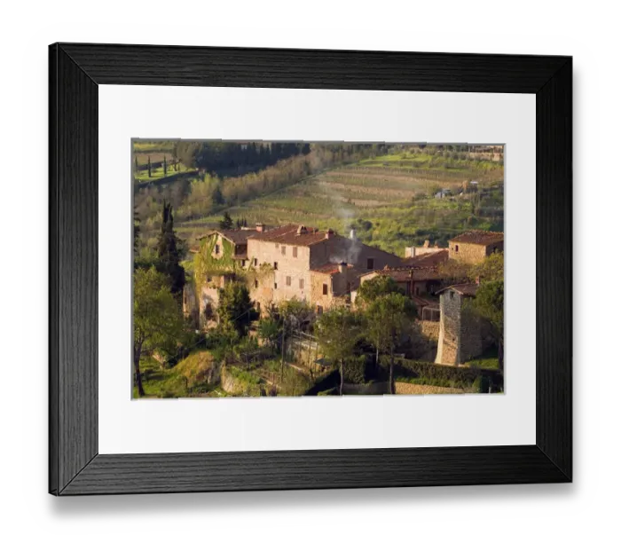 Framed Print : Stone buildings perch on the vineyard-covered hills above the rural town of Lamole Framed Print : Stone buildings perch on the vineyard-covered hills above the rural town of Lamole